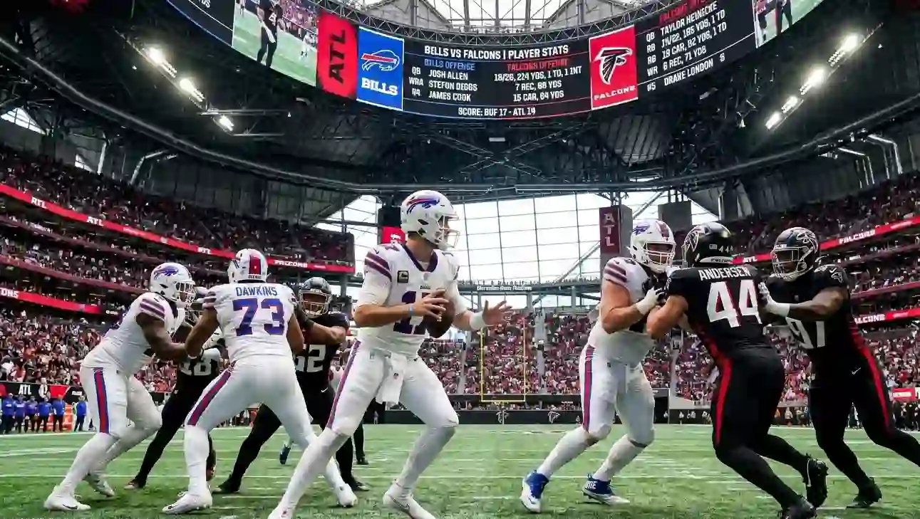 NFL quarterback throwing a pass downfield